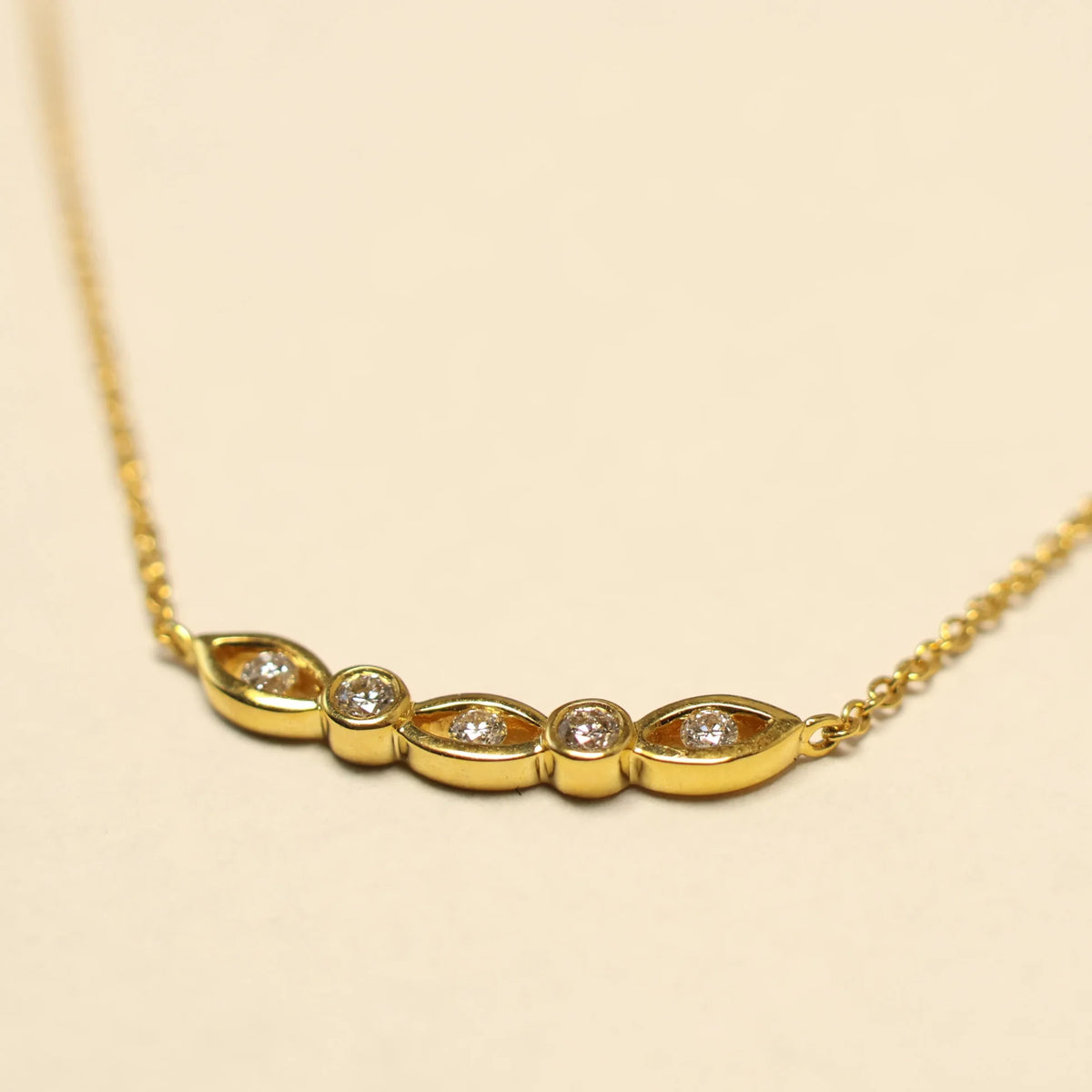 Yellow gold chain brilliant eyes charm 063625A